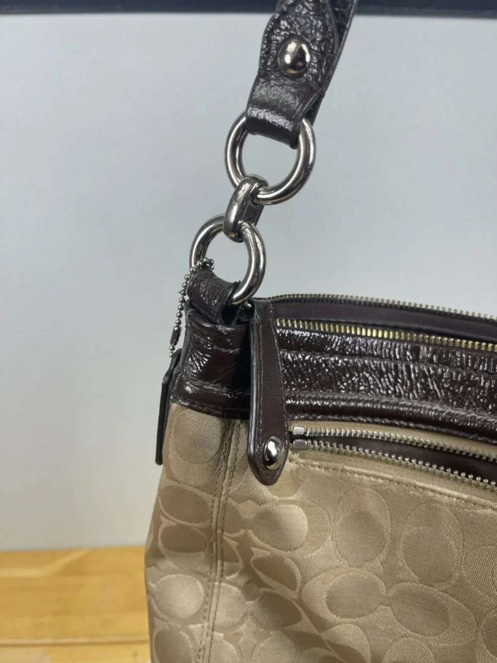 Classic older-era Coach Signature hobo bag featuring jacquard canvas and patent